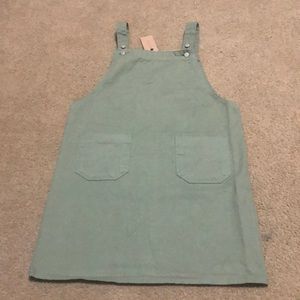 Green apron overall dress.